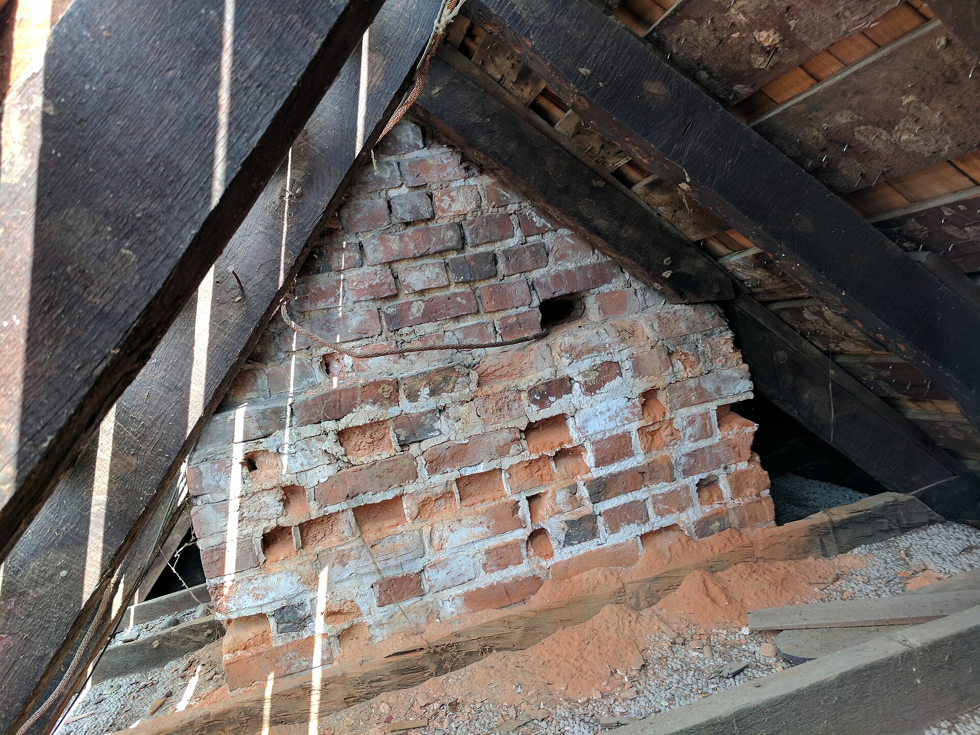 Crumbling brick and mortar inside an old chimney